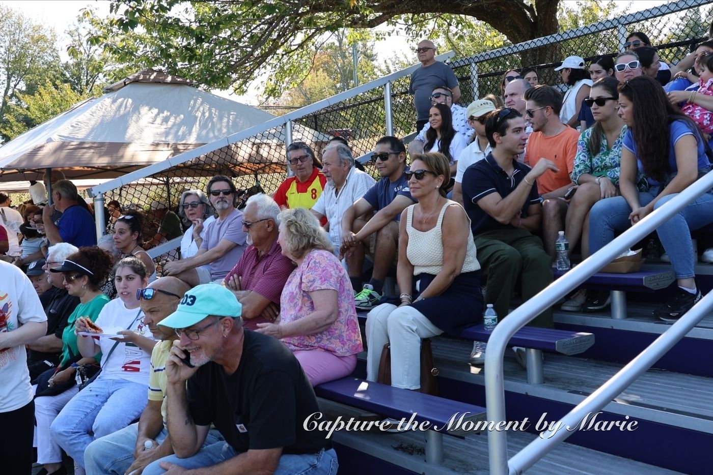 Supporters watching the Final from the shade in 2025.