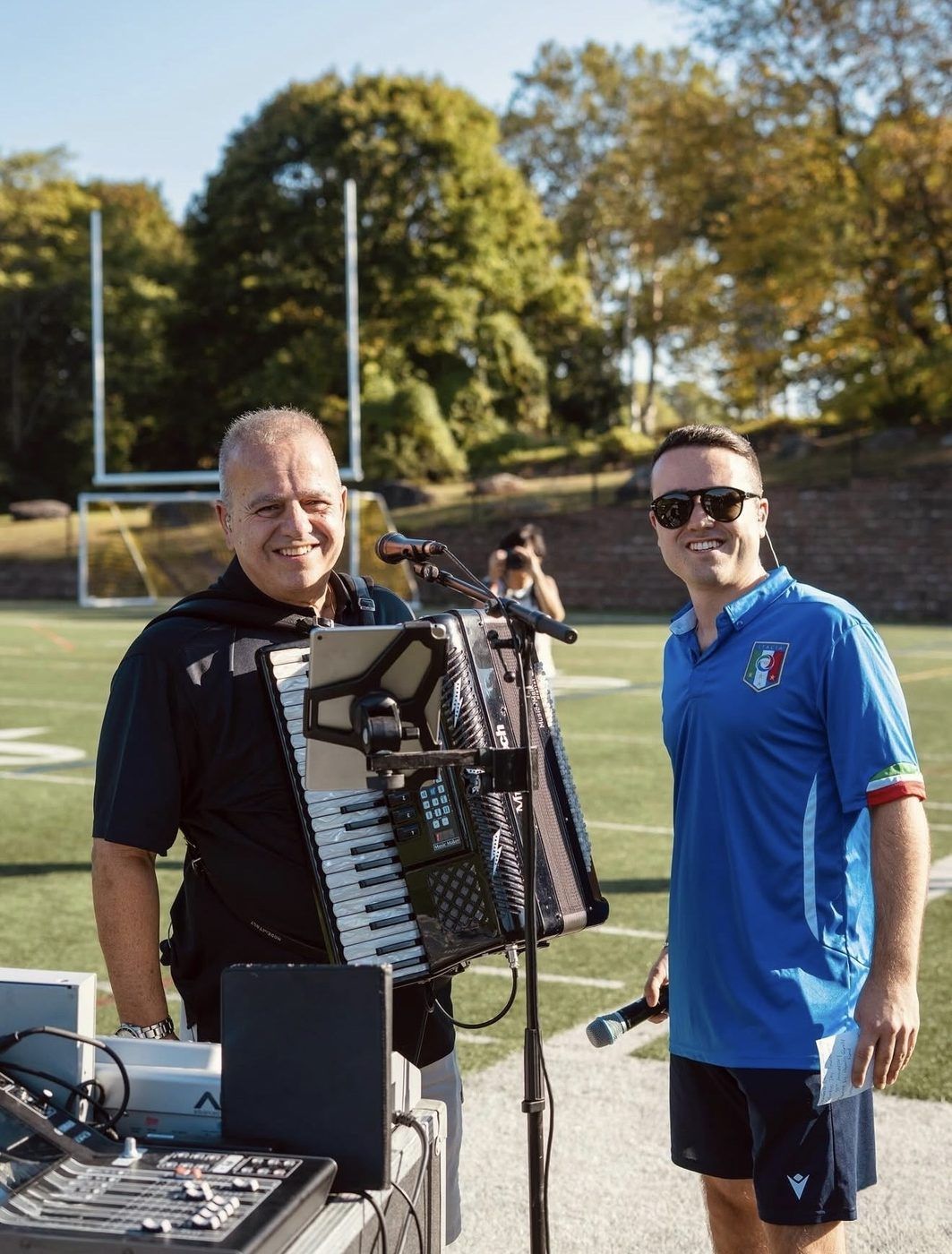 Carozza Entertainment's uncle-and-nephew singing duo after the halftime performance at the 30th Anniversary Finals Celebration