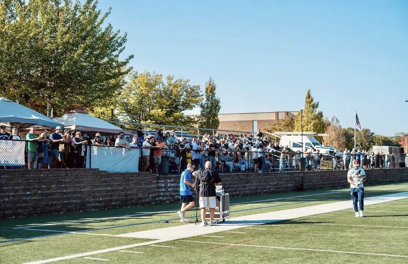 Spectators lining the field at the Stamford Italian Soccer League Columbus Day Tournament Finals